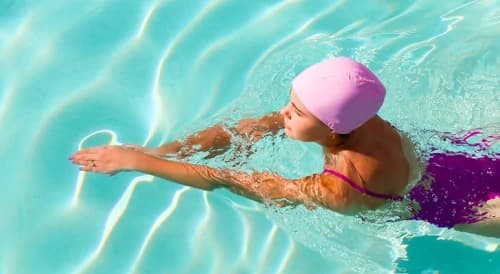 Woman swimming to get back in shape after pregnancy